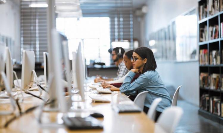 a group of students working in a computer lab