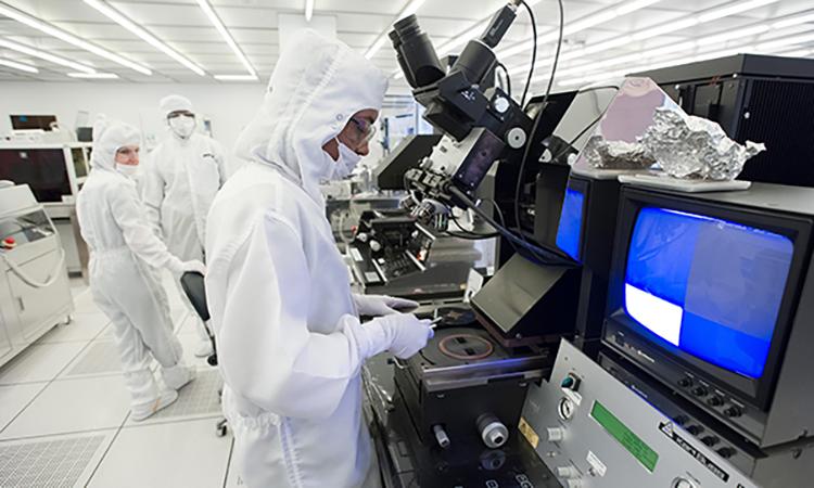 Researchers working on chip development in Georgia Tech's cleanroom, the largest of its kind in the southeast.