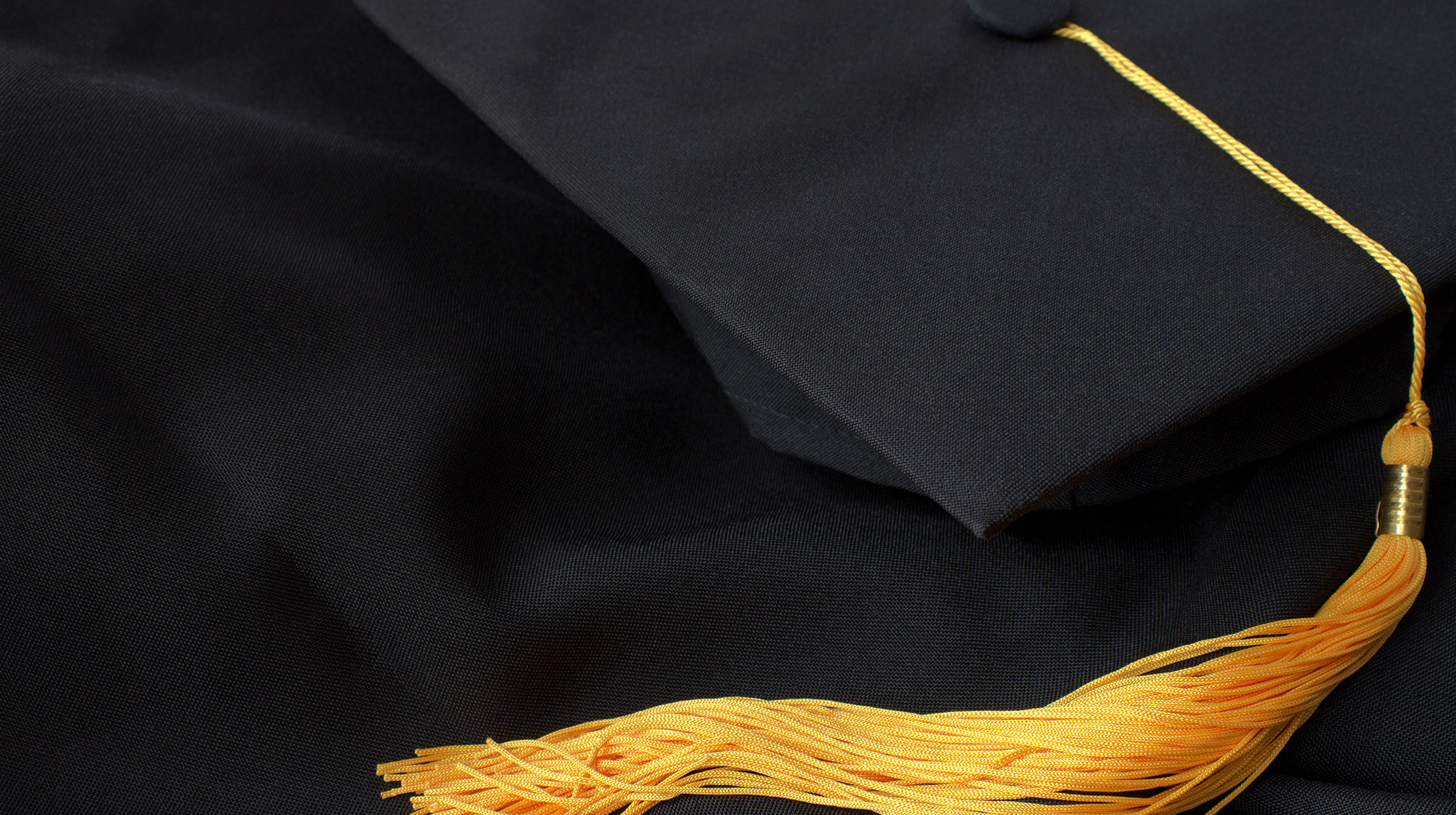Graduation cap placed on gown