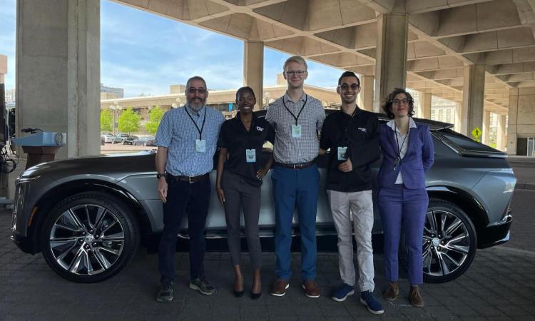 Georgia Tech faculty and students with car