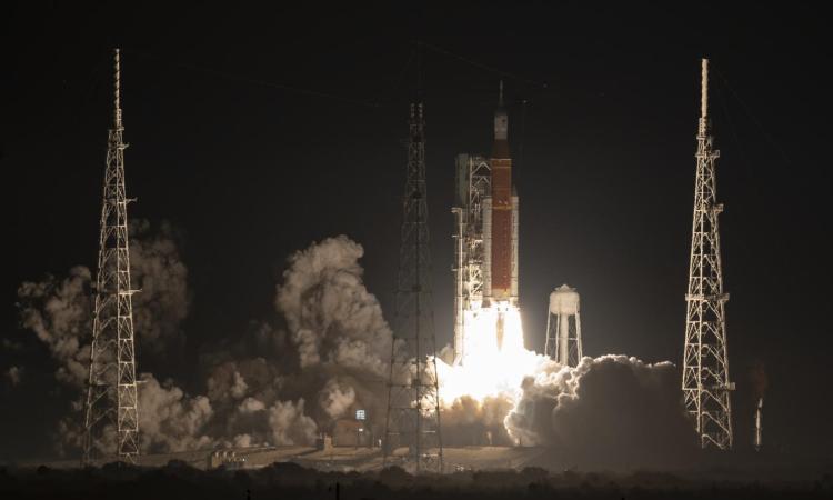 Artemis rocket launching into a night sky