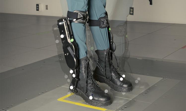 Composite image of a pair of lower legs wearing robotic exoskeleton boots. The image shows light echoes of images depicting how the feet and legs moved during balance disruption experiments.