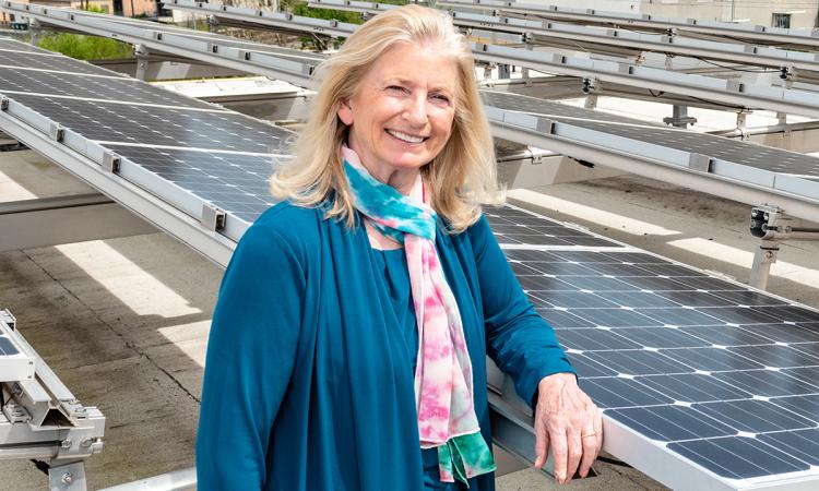 Marilyn Brown with solar panels