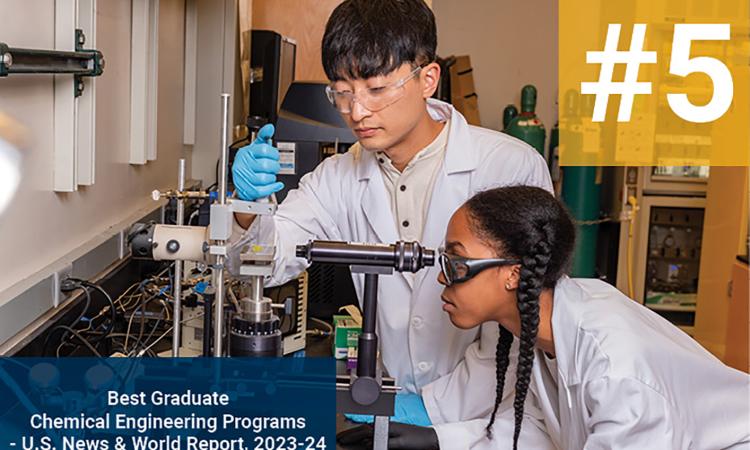 image of two students in the lab with text overlay "#5, Best Graduate Chemical Engineering Programs, U.S. News & World Report, 2023-24"