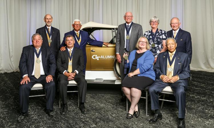 the 2022 Hall of Fame alumni gathered around the Ramblin' Wreck