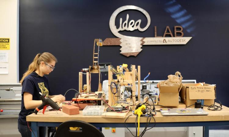 a female student works on the IDEA Lab