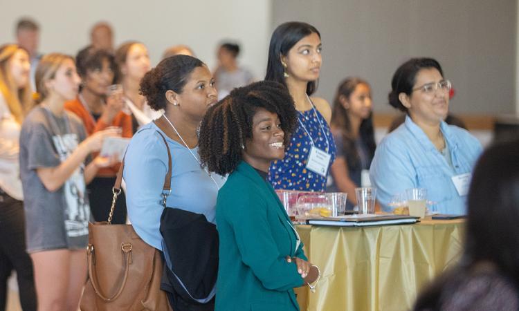 Students listen to speakers at the annual Tea with the Dean for women engineering students.