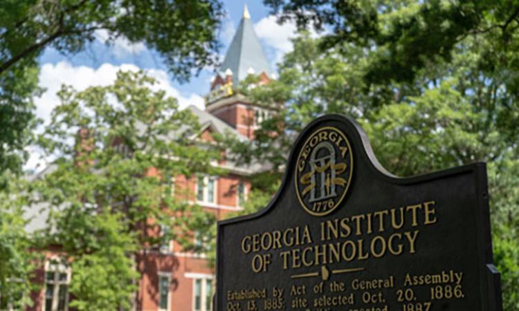 The Georgia Tech historical marker sign with Tech Tower in the background.