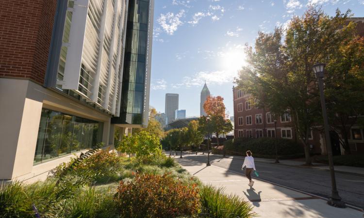 A student walks on Georgia Tech's Campus