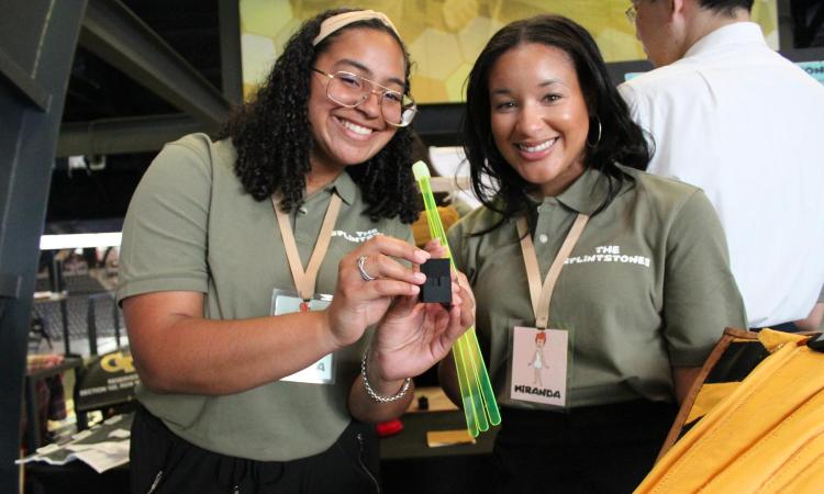 Two students display their project at the Capstone Design Expo