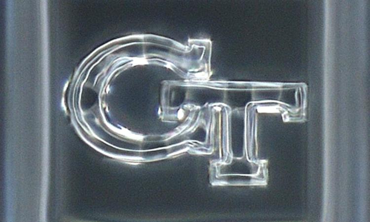 The “GT” logo in glass at only 120 x 80 micrometers.