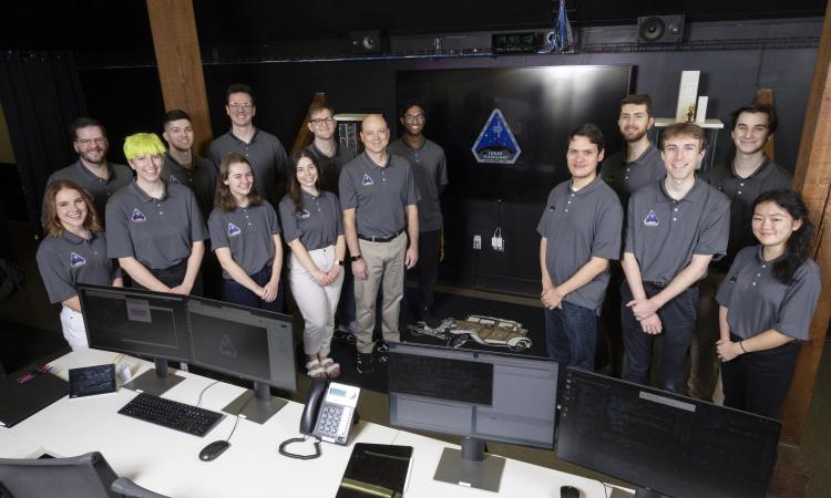 Students and faculty gathered in mission control
