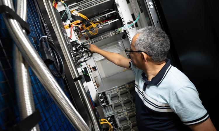 man working with computer equipment