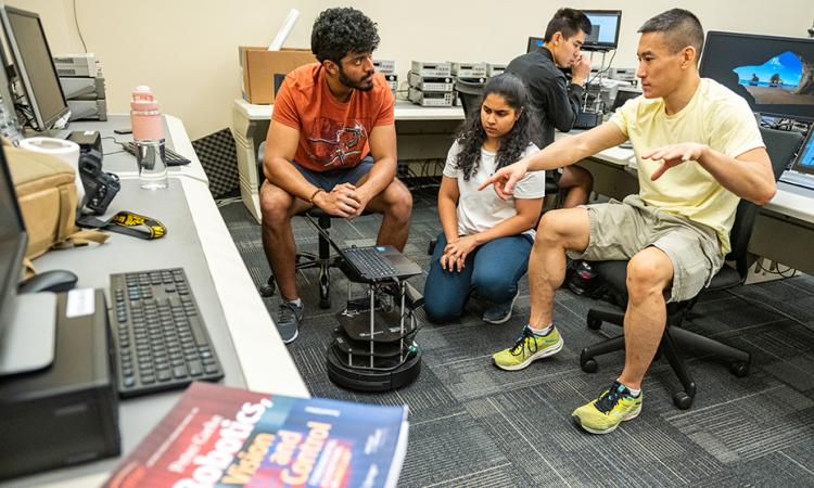 Students work in a computer lab