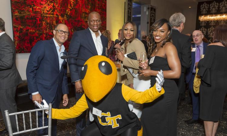 People with Buzz the mascot