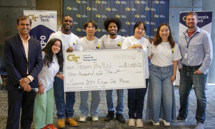 Group of students from Team Big Bird with an oversized check