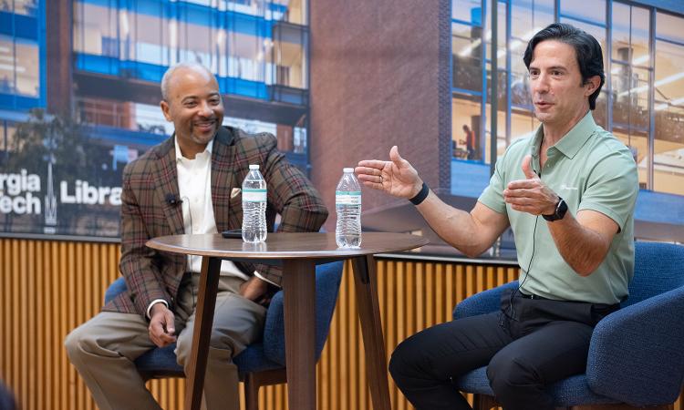 Dean Raheem Beyah and alumnus Vicente Reynal sit at a table