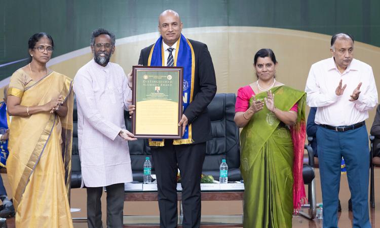 Devesh Ranjan receives an award