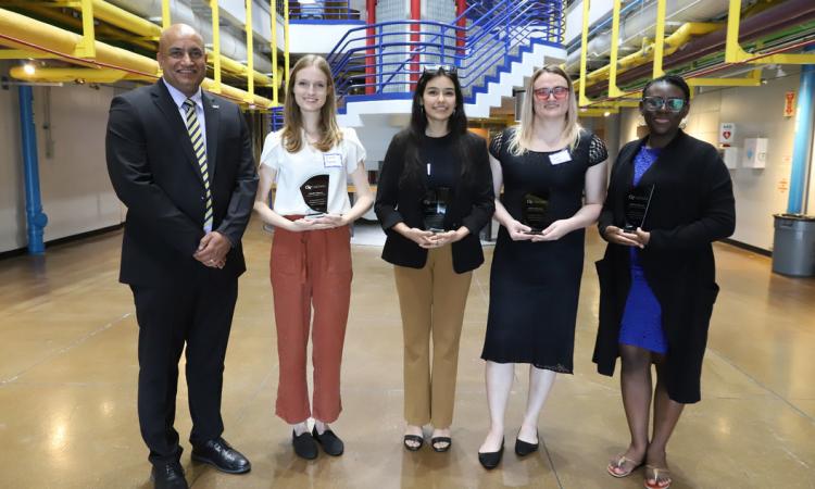 Devesh Ranjan and four students with awards