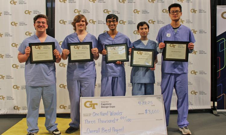 a group of people with an oversized check