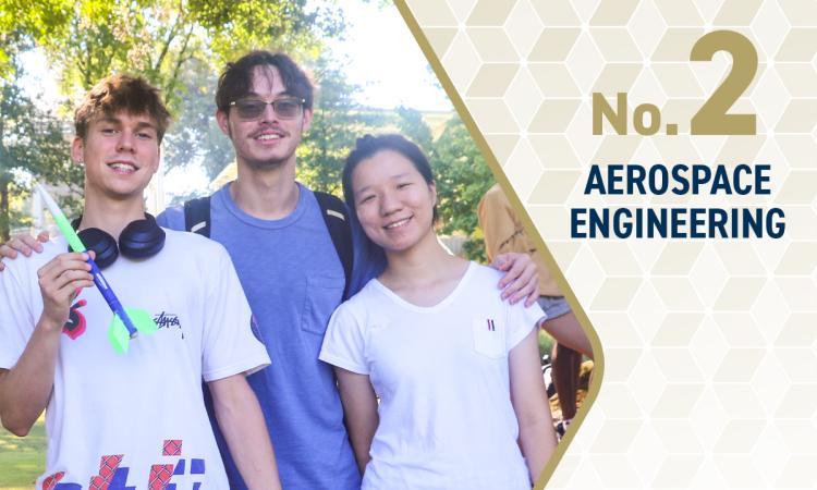 three students holding rockets with the text "No. 2 Aerospace Engineering"