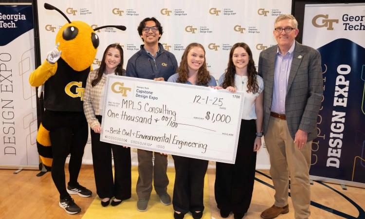 group of students with oversized check