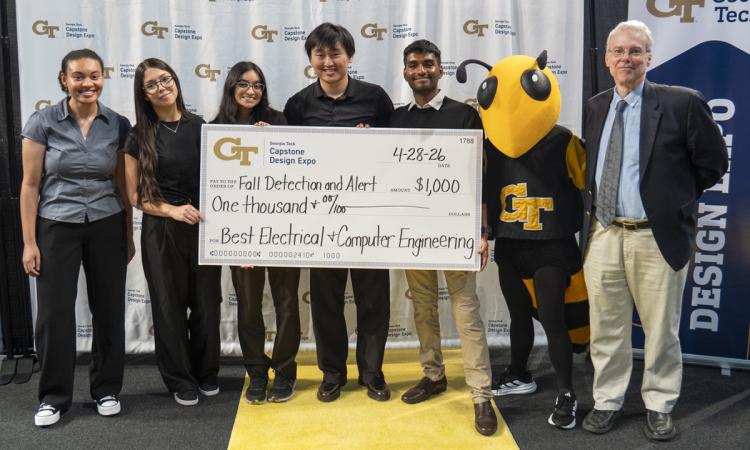 a group of people with an oversized check and Buzz