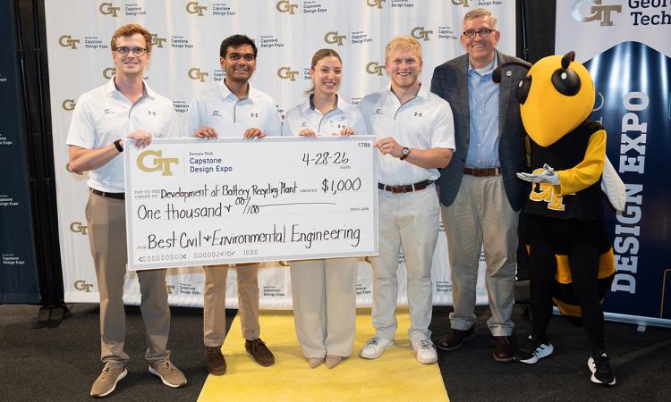 a group of people with an oversized check and Buzz