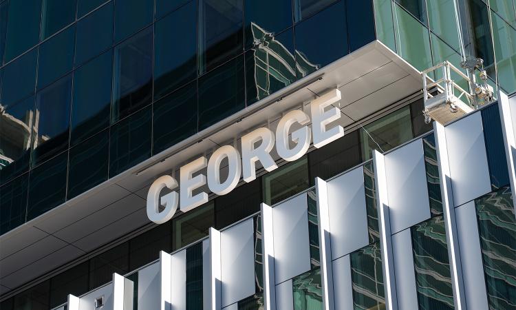 closeup of the "George" sign on the exterior of the new George Tower