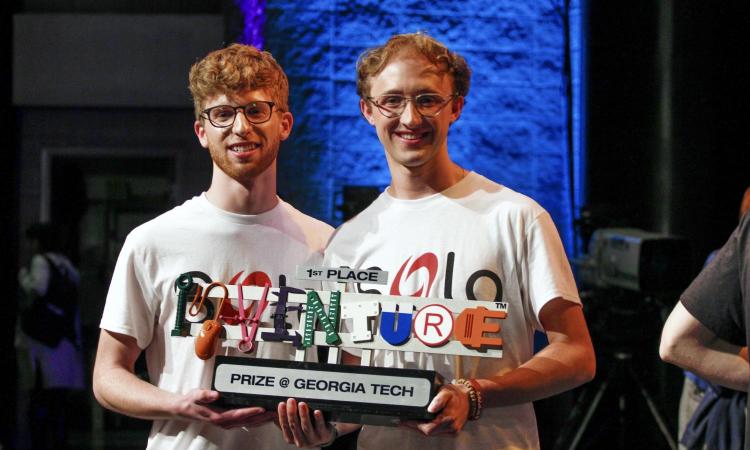 Wessley Pergament and Brayden Drury with the first place InVenture Prize trophy