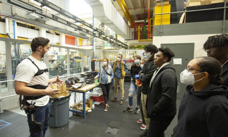 high school students tour mechanical engineering labs