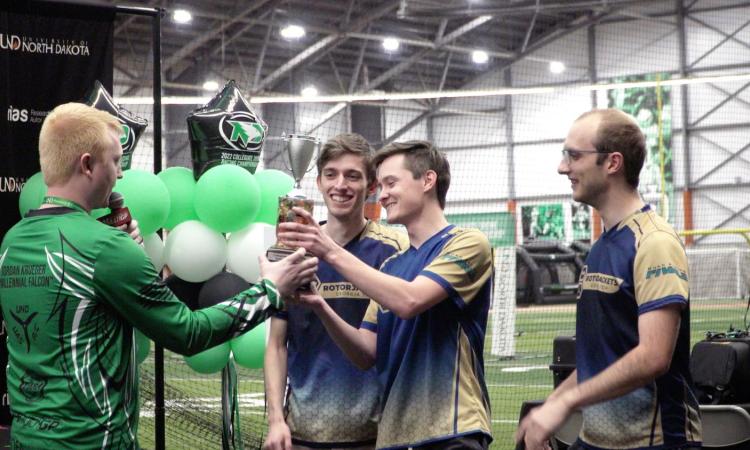 students accepting trophy