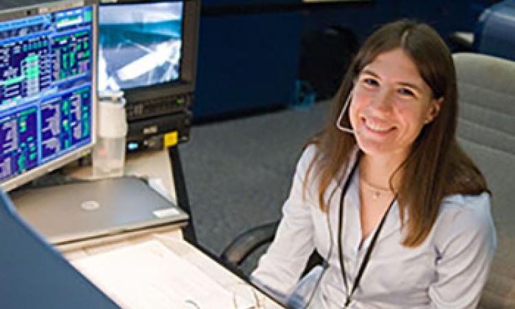 Heidi Brewer at a console at NASA's Johnson Space Center.