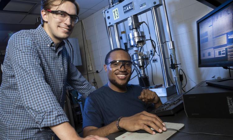 Two students, Alexander Caputo and Benjamin Pollard, in the lab