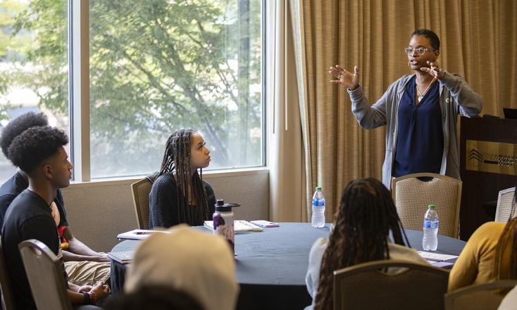 Felicia Benton-Johnson presents at a Tech 411 event for Georgia Tech transfer students. Benton-Johnson is co-leading a National Science Foundation-funded project to better understand the interruptions that can stymie Black women pursuing STEM degrees. (Photo: Candler Hobbs)