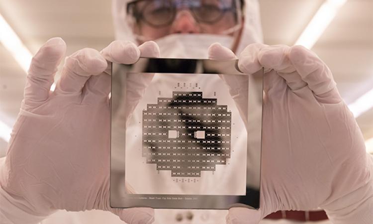 Cleanroom worker holding a wafer