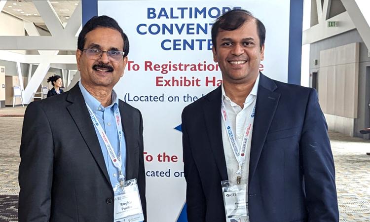 Raghu Pucha and Amit Jariwala together at a conference.