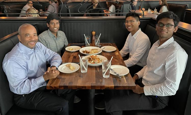 Four men in a restaurant booth:   Dean Raheem Beyah with GT VizTools team members Siva Appana, Ian Kwuan, and Jathin Gadiparthi.