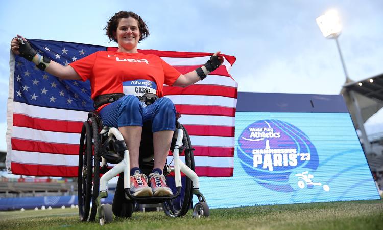 Cassie Mitchell with the U.S. flag at the 2023 World Para Athletics Championships in Paris. (Photo: Marcus Hartmann, U.S. Olympic and Paralympic Committee)
