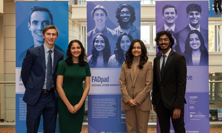 The FADpad team with their poster at the Collegiate Inventors Competition. From left, Ethan Damiani, Netra Gandhi, Rhea Prem, and Girish Hari. (Photo Courtesy: National Inventors Hall of Fame)