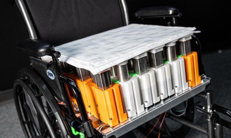 Closeup view of a customized wheelchair system, including fabric sensors, design to prevent pressure injuries