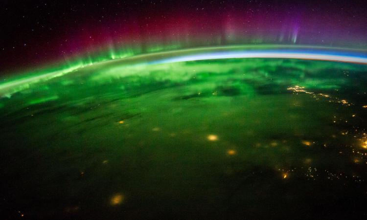 view of Earth and auroras, taken by NASA astronaut