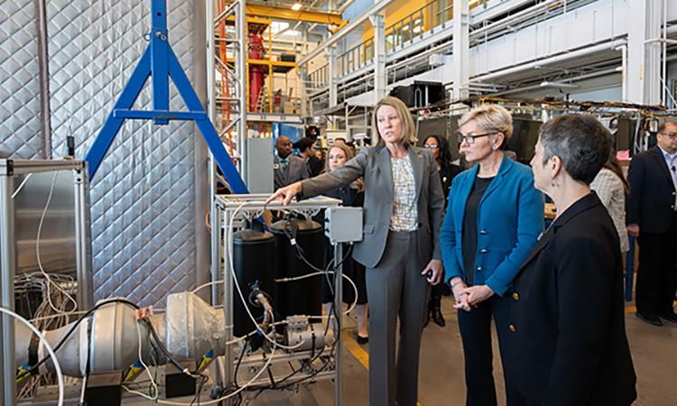 Georgia Tech's associate vice president and ChBE faculty member Krista Walton explains a pilot direct air capture device to U.S. Secretary of Energy Jennifer Granholm.