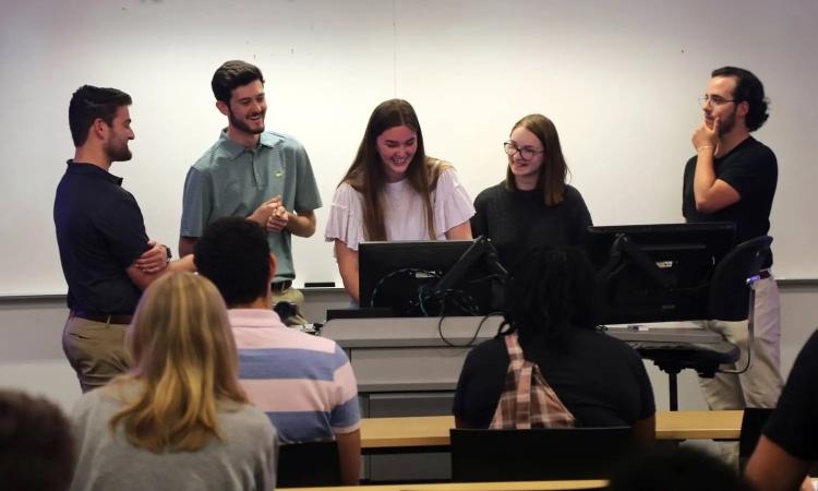   Students prepare for a presentation during Professor Adjo Amekudzi-Kennedy's CEE Systems course for second-year students.