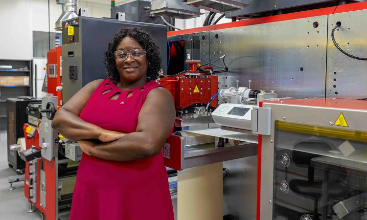 Tequila Harris, professor in the George W. Woodruff School of Mechanical Engineering, next to the modular R2R equipment. (Photo: Christopher McKenney.)