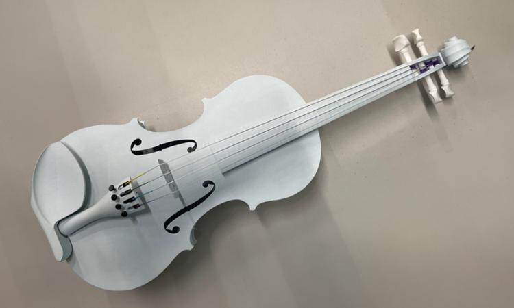 A light gray polymer violin created with 3D-printing technology