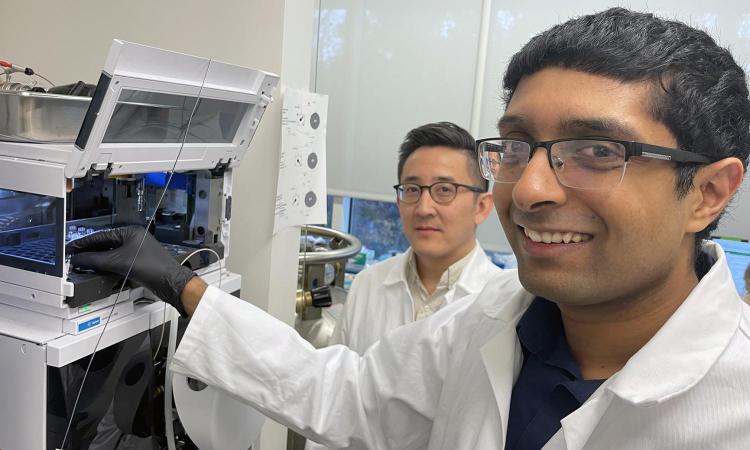 Anirudh Sivakumar (right) and Gabe Kwong standing in the lab.
