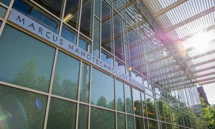 Glass front of a building with sign reading "Marcus Nanotechnology Building"