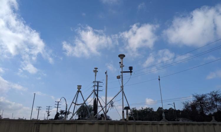 A series of poles on tripods with various instruments attached at a Los Angekes Atmospheric Science and Chemistry mEasurement NeTwork (ASCENT) site. (Photo Courtesy: Haroula Baliaka)