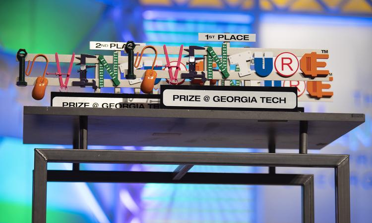 1st and 2nd place InVenture Prize trophies on a table during the live televised final.